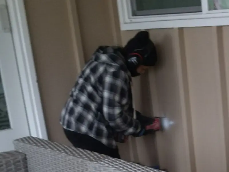 Professional electrician installing an exterior outlet in Mount Sterling